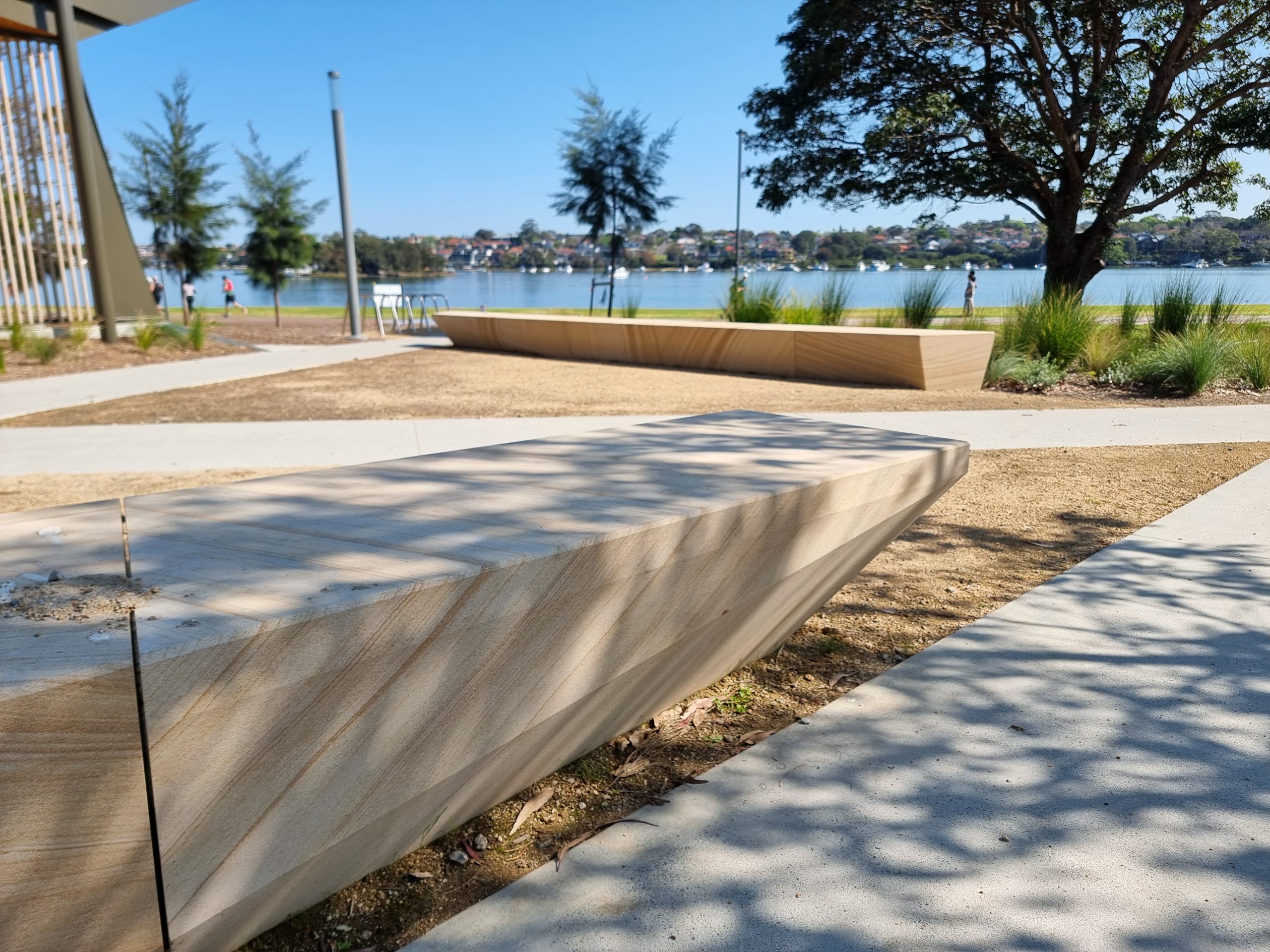 Detailed view of diamond and circular window cutouts framed in Gosford sandstone.