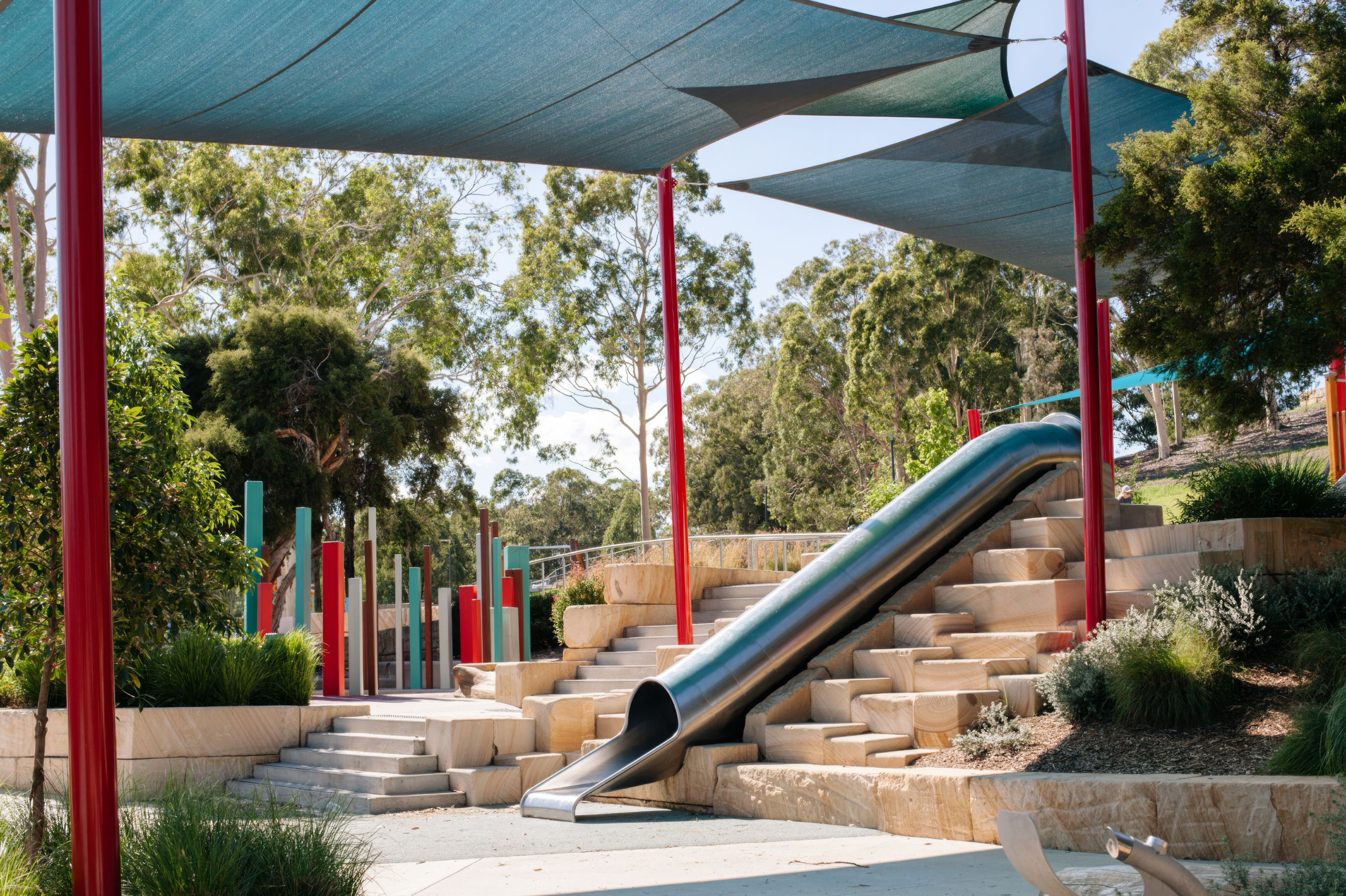 CNC-profiled curved sandstone cladding at Wynyard Walk, Sydney. Stone by Gosford Quarries.